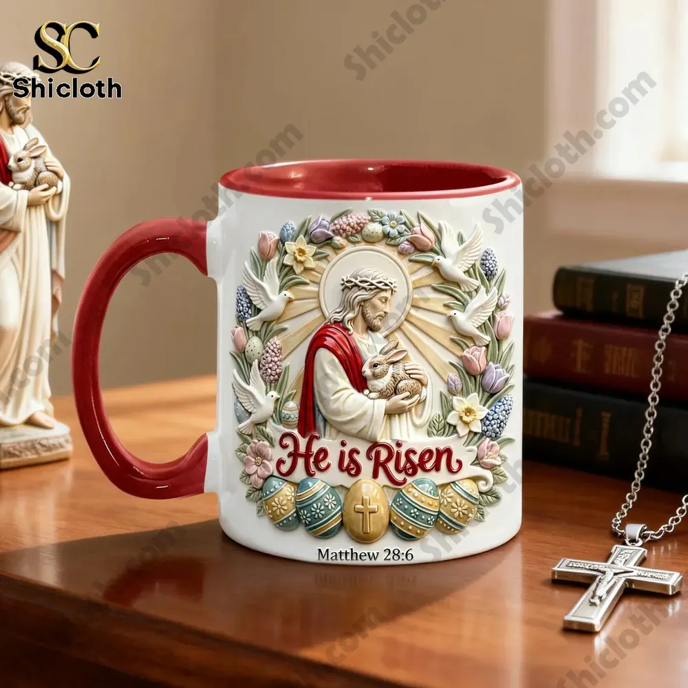 He is Risen Easter Ceramic Mug 4 Red and white He is Risen Easter Christian mug on wooden table with cross necklace.