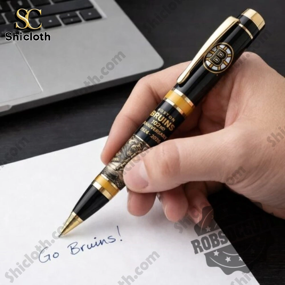 Hockey Team Boston Bruins 102nd Anniversary Pen 3 Hand writing on paper using a black and gold commemorative hockey themed pen!