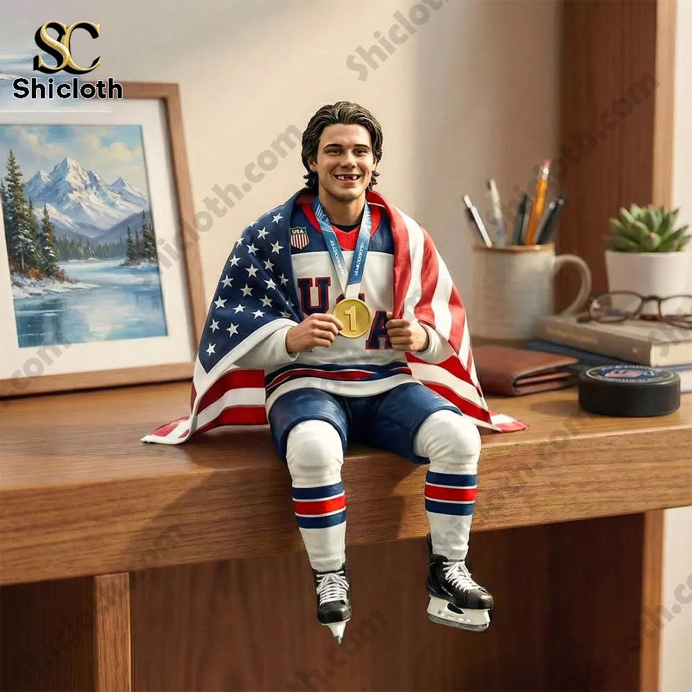 USA hockey player figure wearing American flag and holding gold medal on a desk