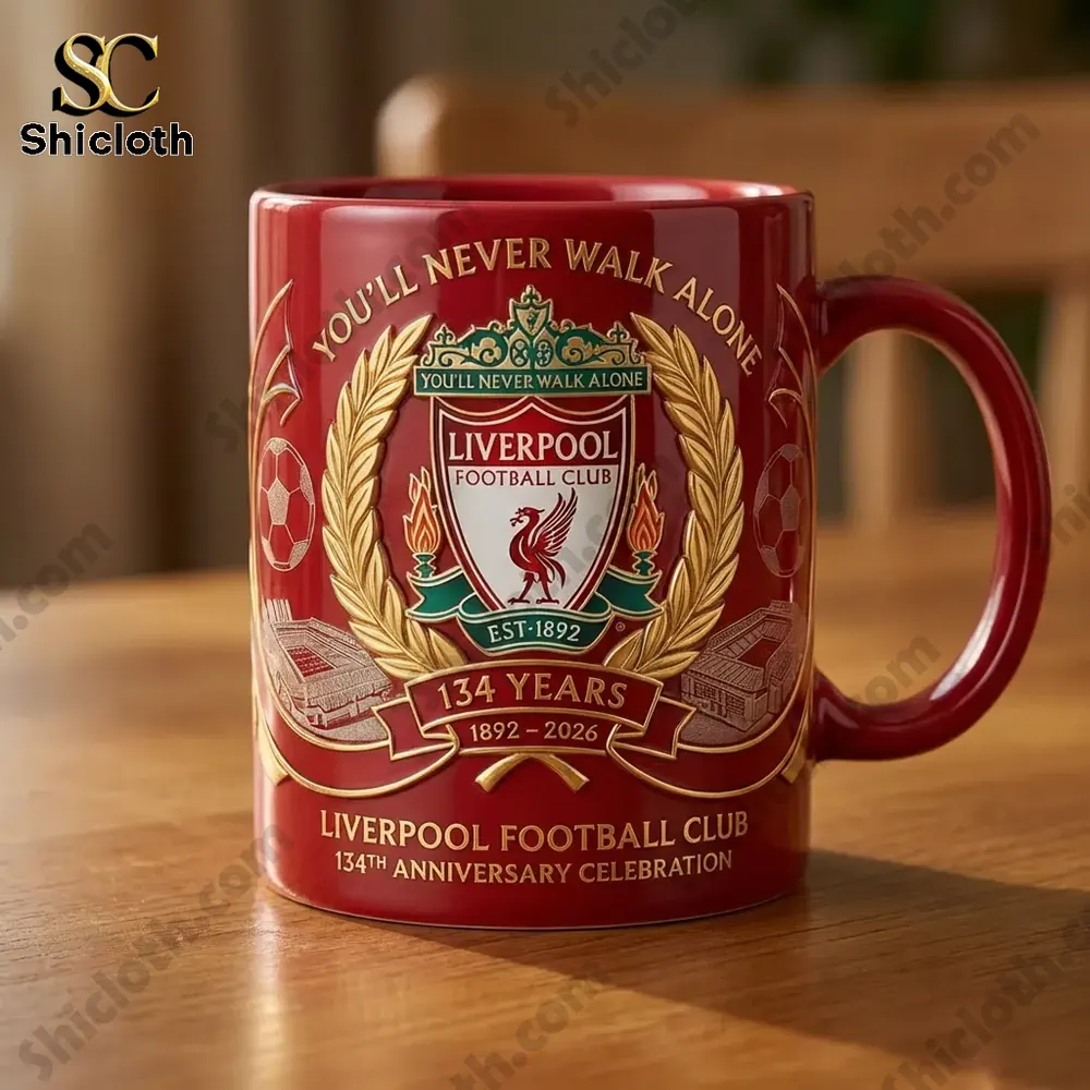 Close up of a red Liverpool FC 134th anniversary celebration mug on a table.