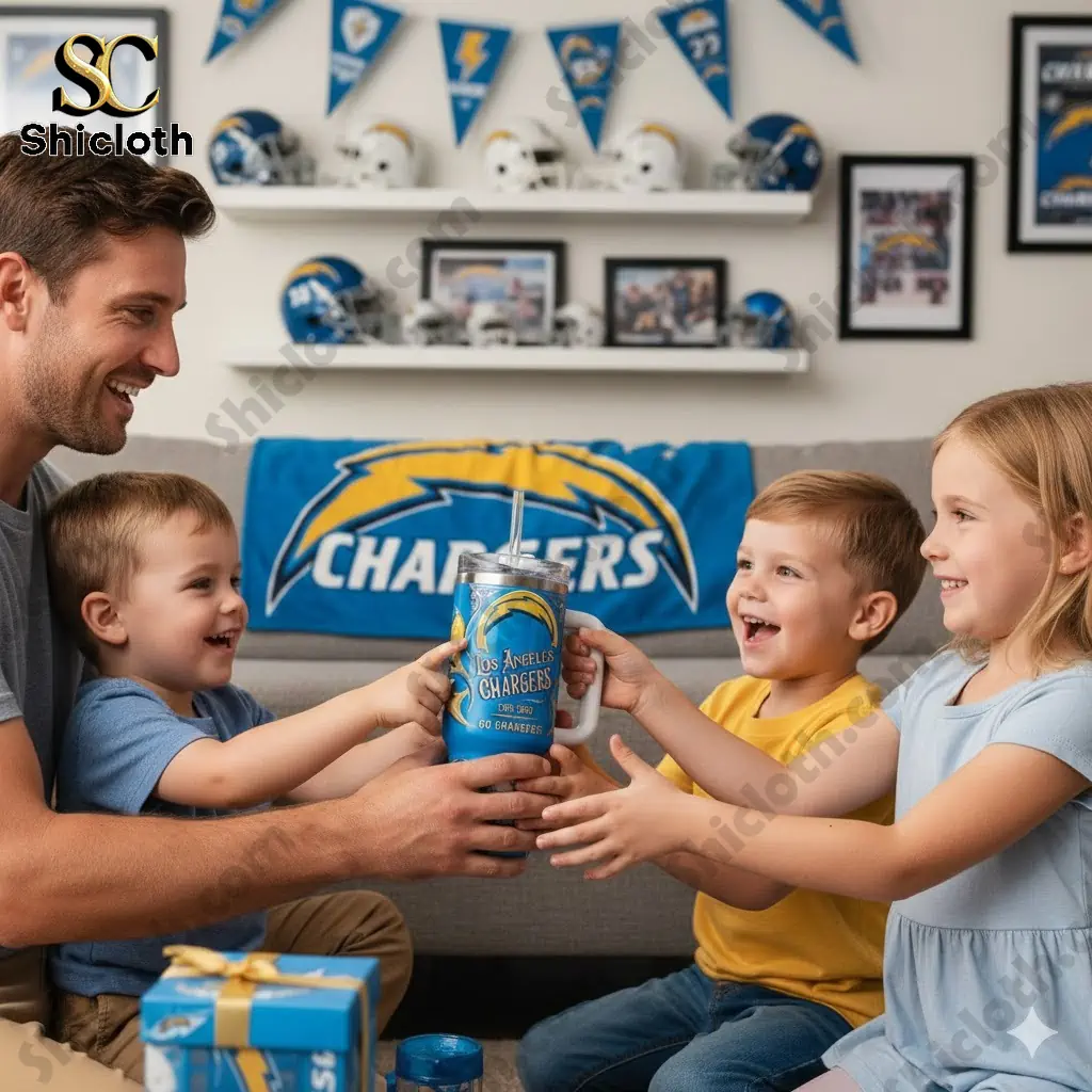 Family smiling and holding Los Angeles Chargers Bolt Up Special YETI Tumbler in Chargers themed living room.