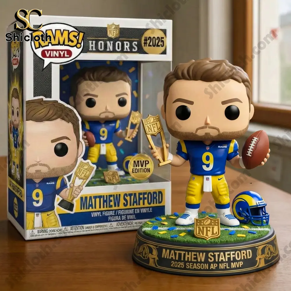 Matthew Stafford vinyl figure holding an NFL MVP trophy beside its box on a wooden table.