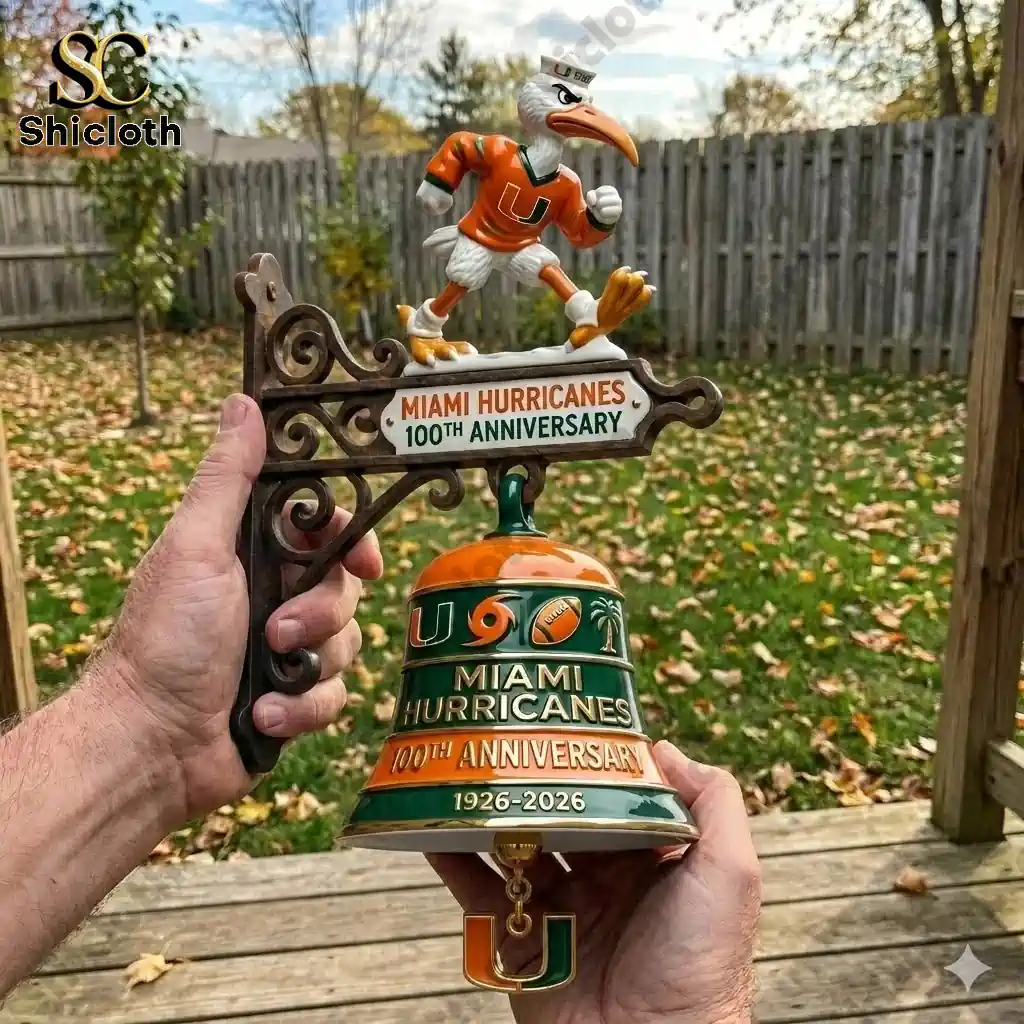 Miami Hurricanes one hundredth anniversary wall bell held in hands outdoors