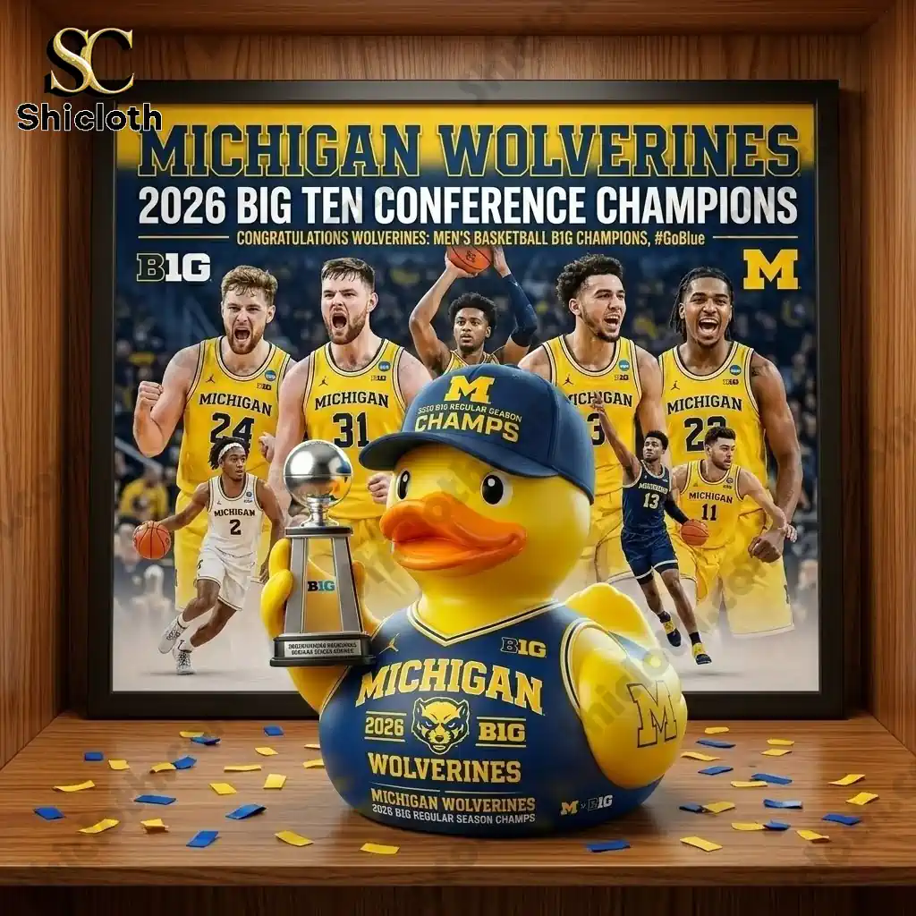 Michigan Wolverines 2026 Big Ten Conference Champions duck figure displayed in front of championship team poster.
