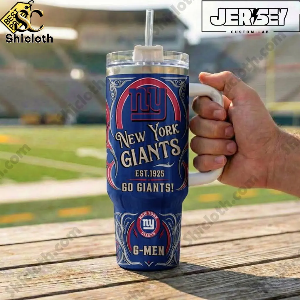 Close up of New York Giants G Men tumbler by Shicloth held at football stadium