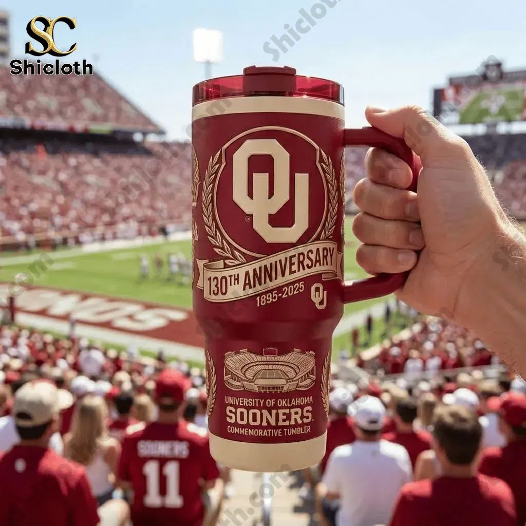 Oklahoma Sooners 130th Anniversary Tumbler 3 Hand holding an Oklahoma Sooners 130th Anniversary tumbler inside a football stadium crowd!