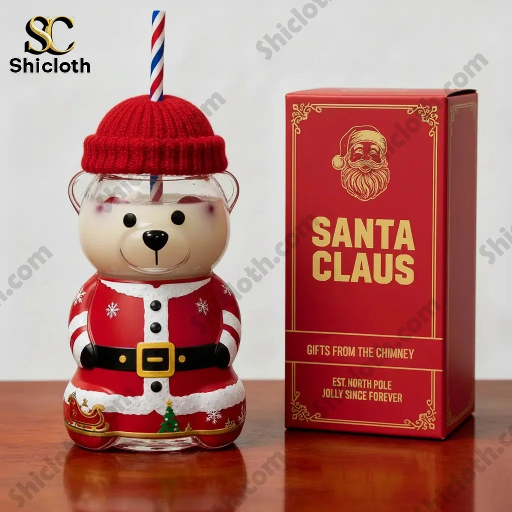Santa bear shaped cup with straw next to a red Santa Claus gift box