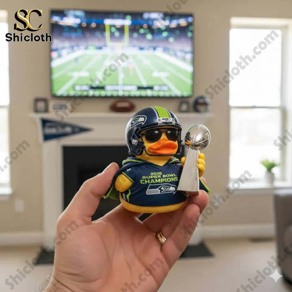 Rubber duck wearing Seattle football helmet holding championship trophy indoors!