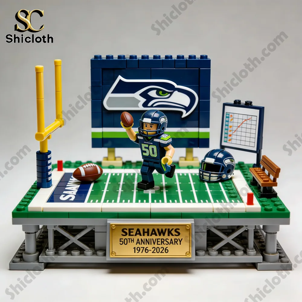 Seattle Seahawks 50th anniversary building block display with football field, player figure, and logo backdrop.