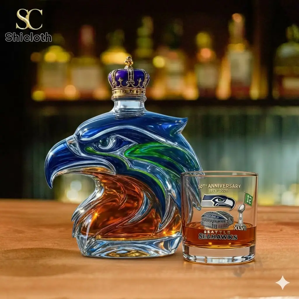 Alt text Eagle head glass whiskey bottle with crown beside Seahawks glass on bar!