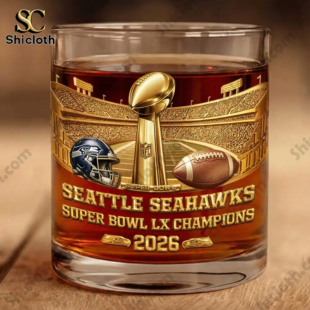 Close up of Seattle Seahawks Super Bowl LX Champions 2026 whiskey glass with gold championship design.