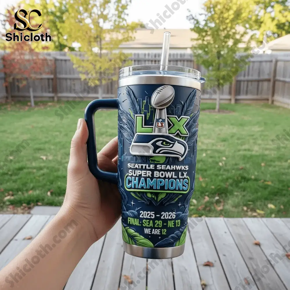 Pokemon 30th Anniversary 1996-2026 Custom Name Tumbler 9 Seattle Seahawks championship travel mug held outdoors.