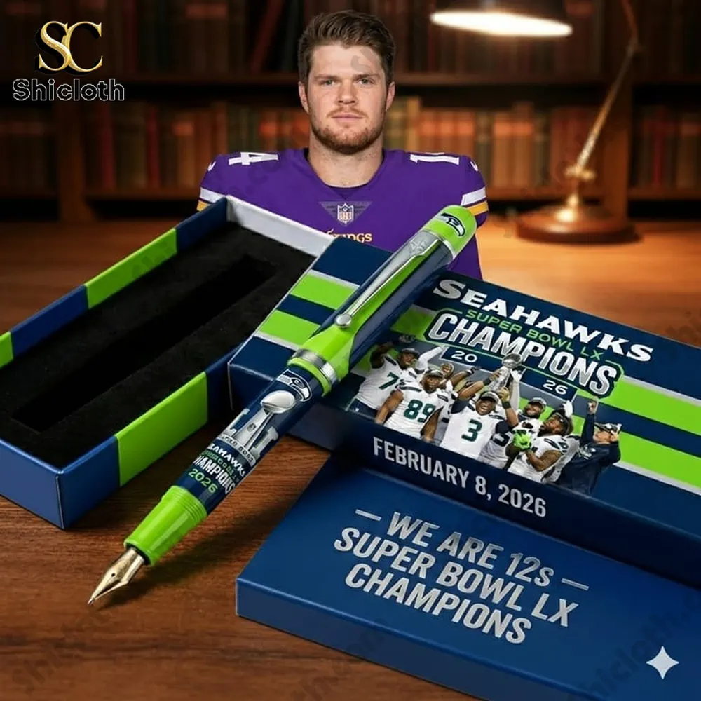 Seattle Seahawks We Are 12s - Super Bowl Lx Champions Pen 3 Seattle Seahawks themed fountain pen gift set displayed with a football player in the background.