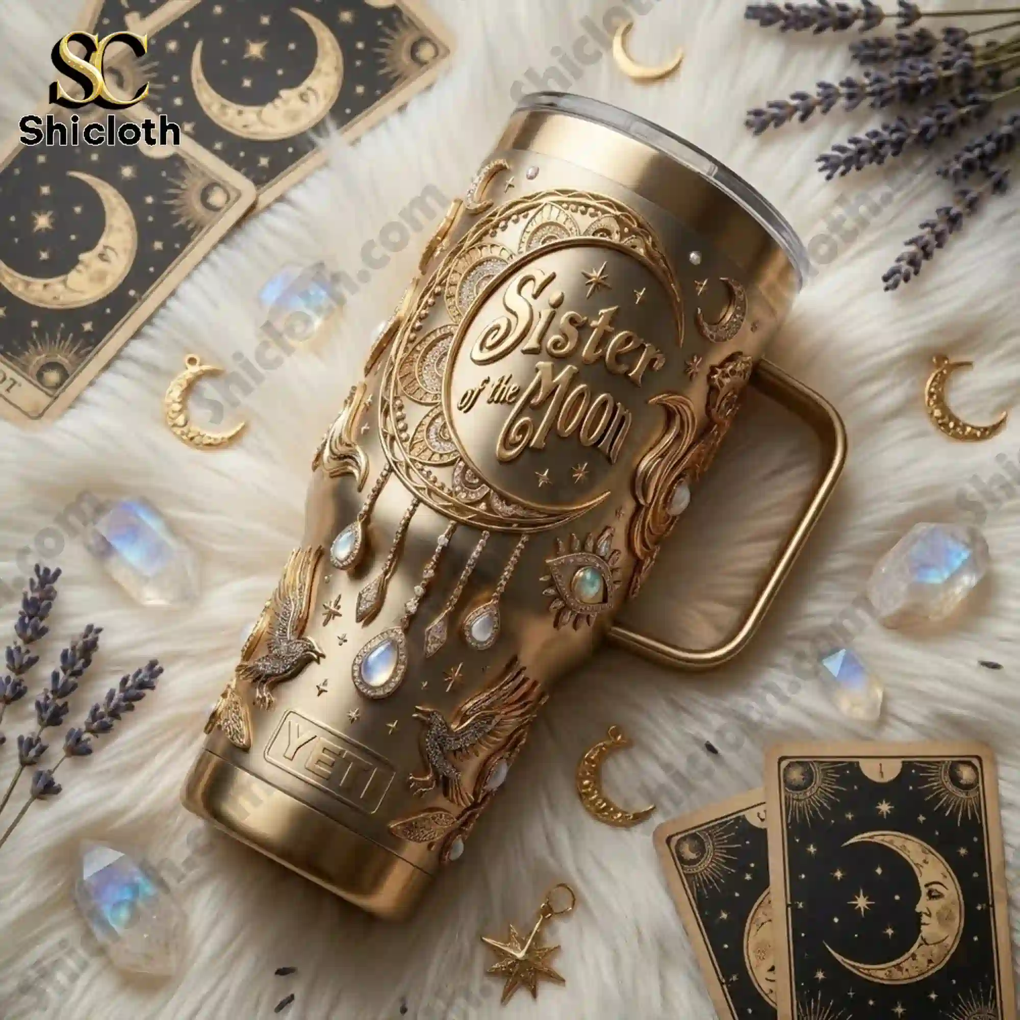 Sister of the Moon Celestial Gold Goddess 40oz Tumbler With Handle 5 Sister of the Moon gold tumbler lying on soft fabric with tarot cards crystals and moon charms!