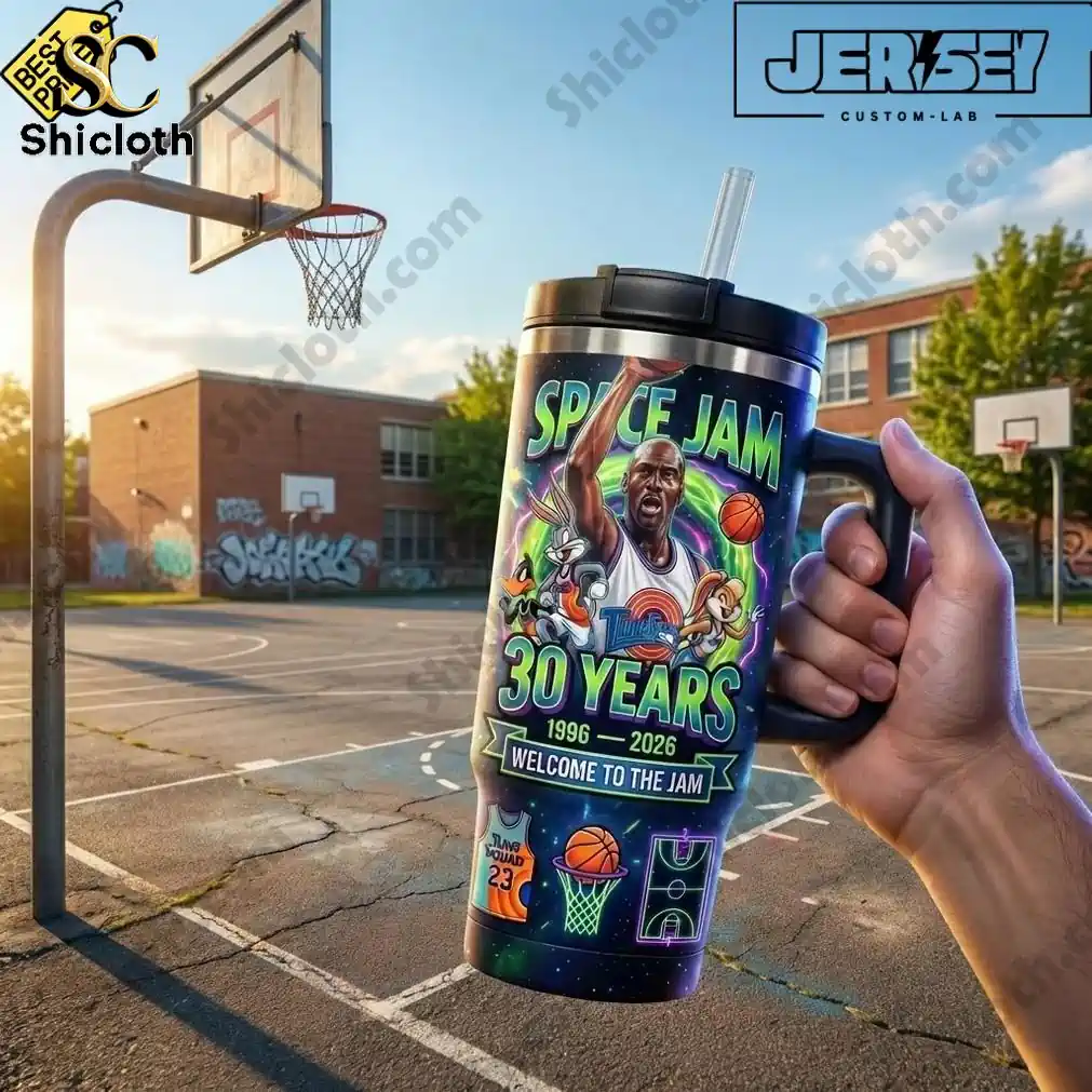 Space Jam 30th Anniversary Tune Squad 40oz Tumbler 3 Hand holding Space Jam 30 Years tumbler on outdoor basketball court.