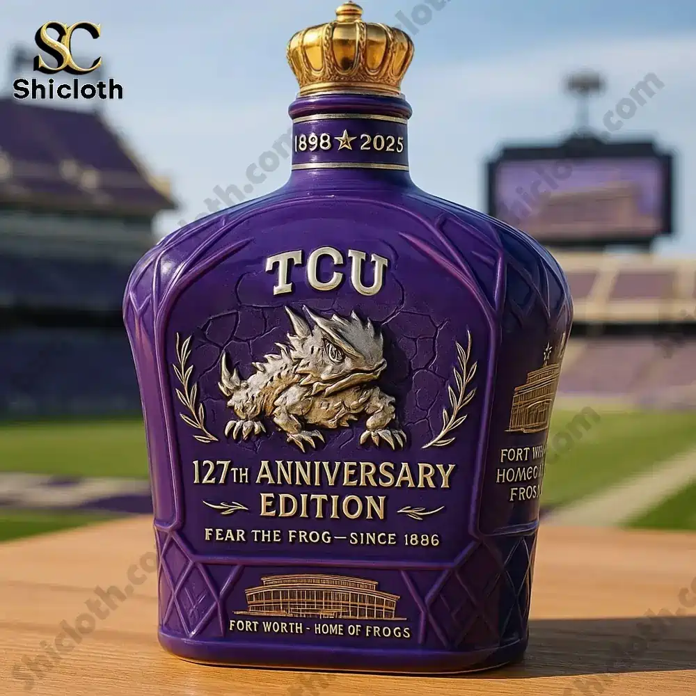 Purple TCU 127th Anniversary Edition bottle with gold crown cap on stadium background.