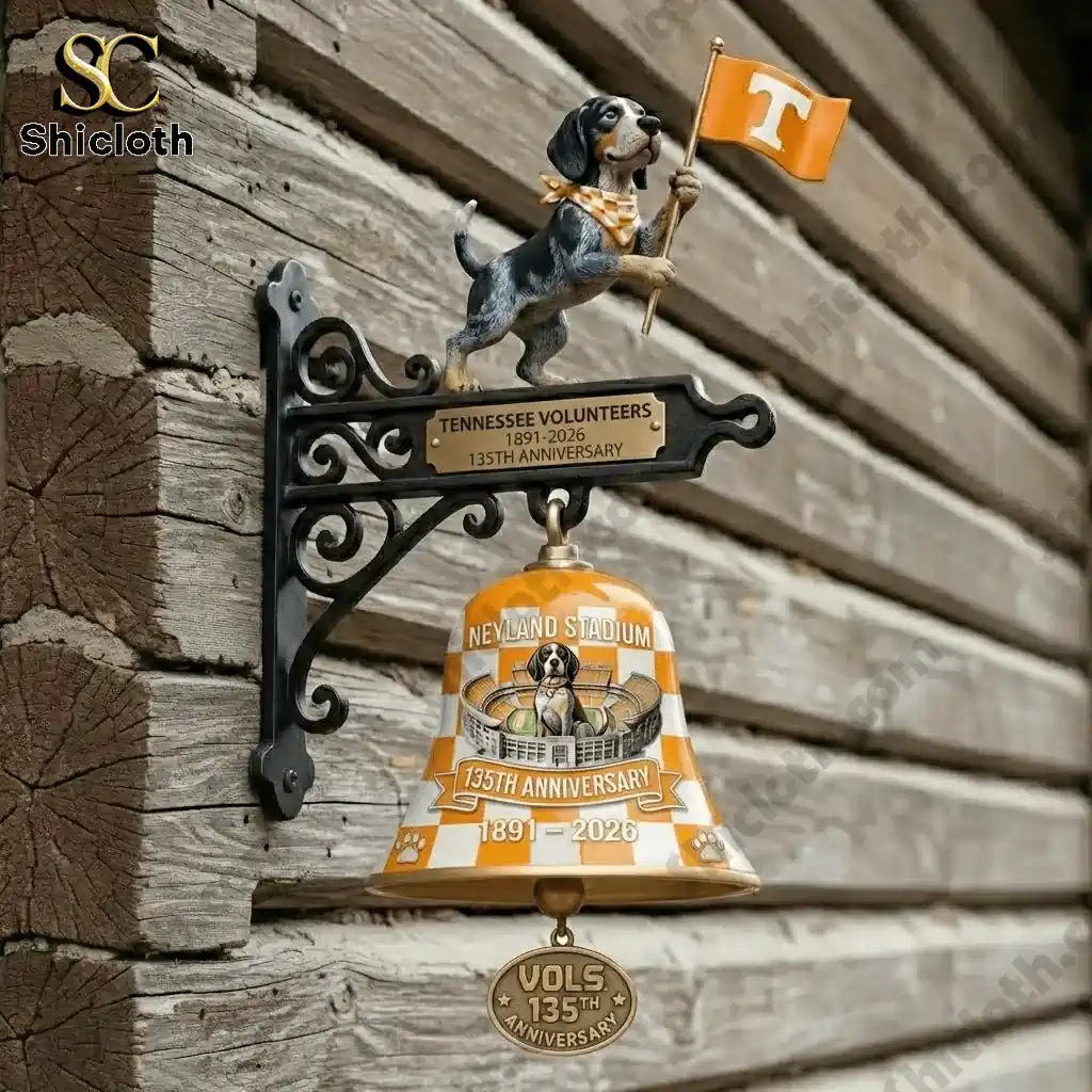 Tennessee Volunteers 135th Anniversary wall bell mounted on wooden wall with dog holding orange flag