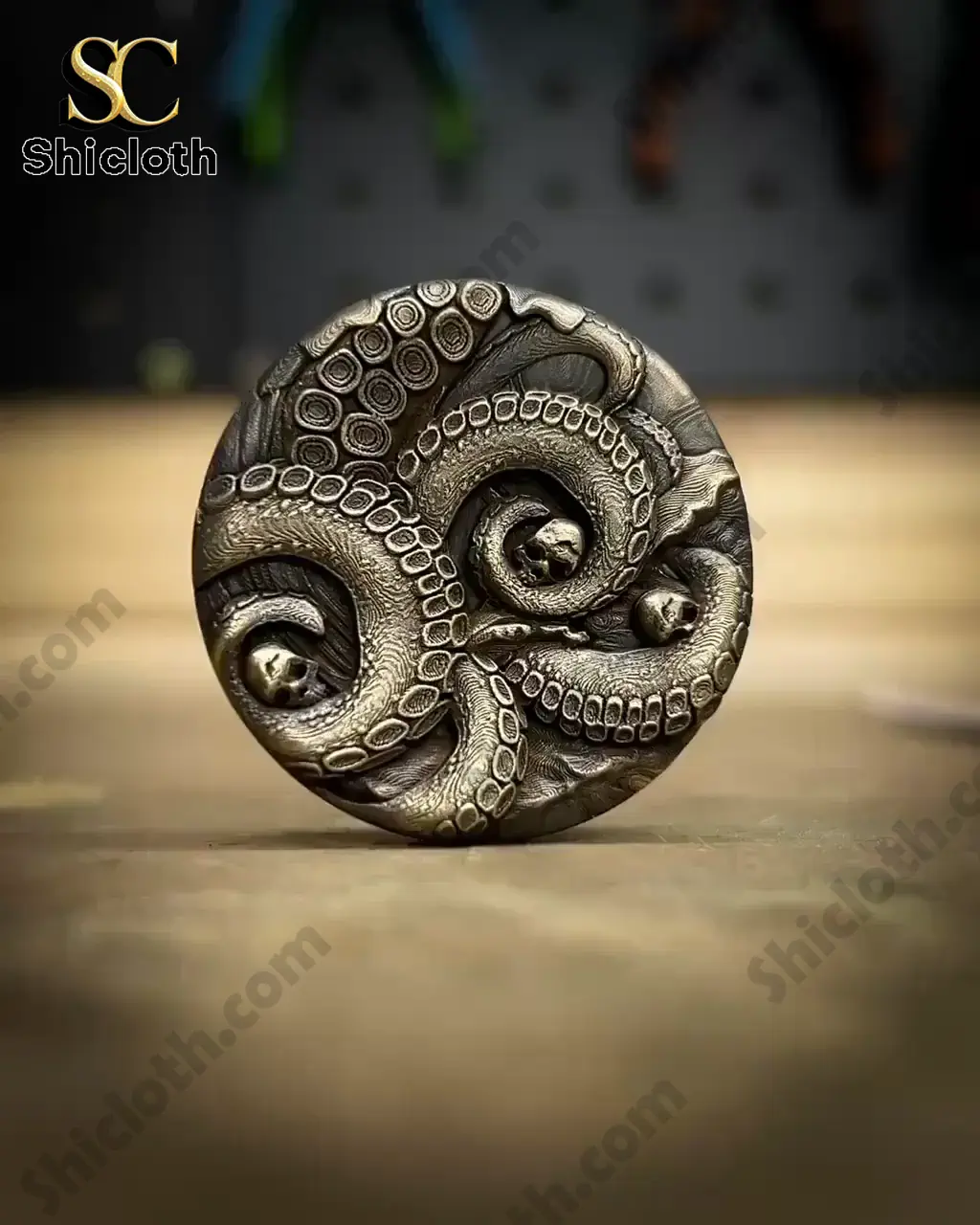 Close up of Shicloth coin featuring sea monster tentacles and skulls