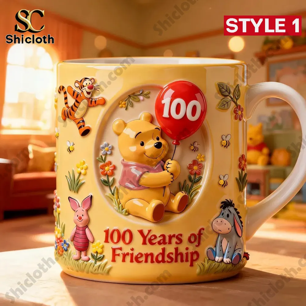 The Pooh 100Th Anniversary Mug 3 Yellow Winnie the Pooh mug with 100 years of friendship design on a table!