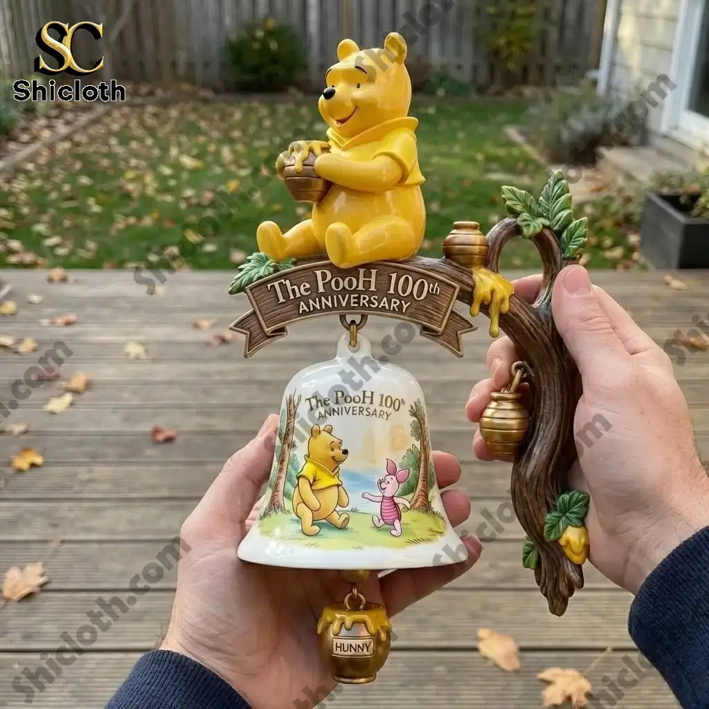 The Pooh One Hundredth Anniversary wall bell held in hands outdoors by Shiclothg!