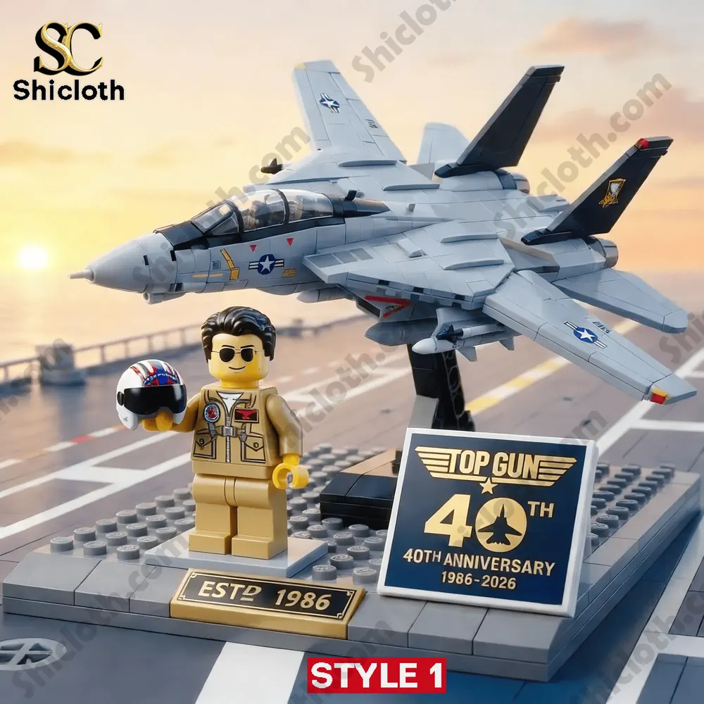 Fighter jet brick model on an aircraft carrier deck with pilot figure and anniversary sign.