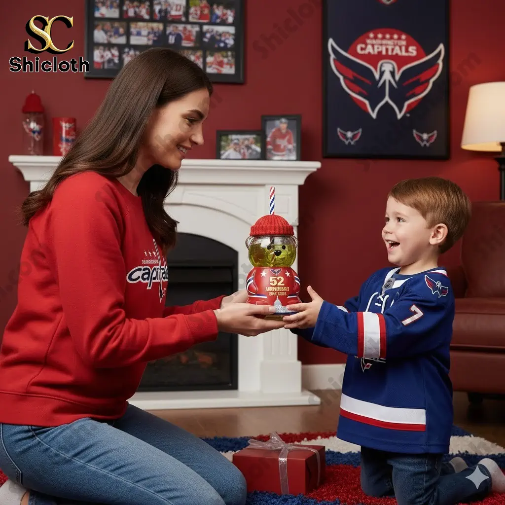 Woman giving a Washington Capitals bear bottle gift to a young boy in a team themed living room!