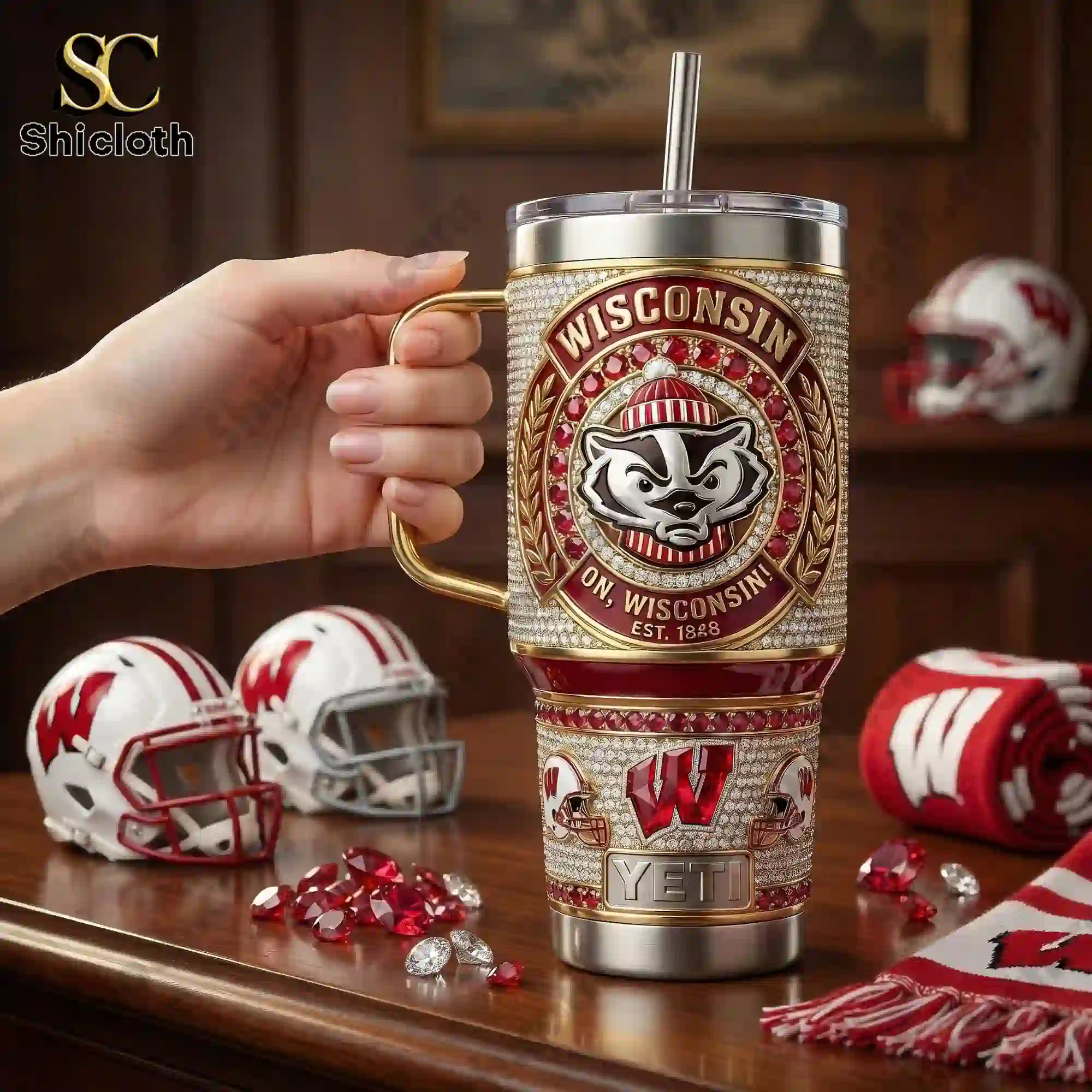Wisconsin Badgers 40oz Tumbler With Handle 4 Hand holding Wisconsin Badgers tumbler with handle in sports themed room