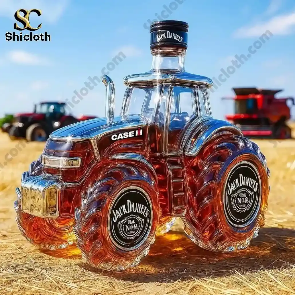 Jack Daniels themed tractor shaped whiskey decanter on a farm field.