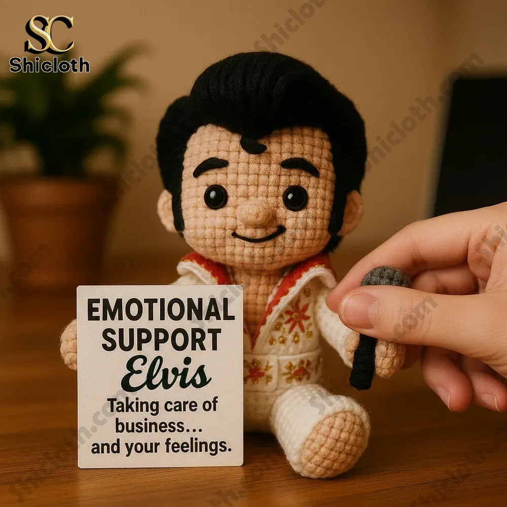 Hand holding the microphone of the Shicloth Emotional Support Elvis crochet doll!