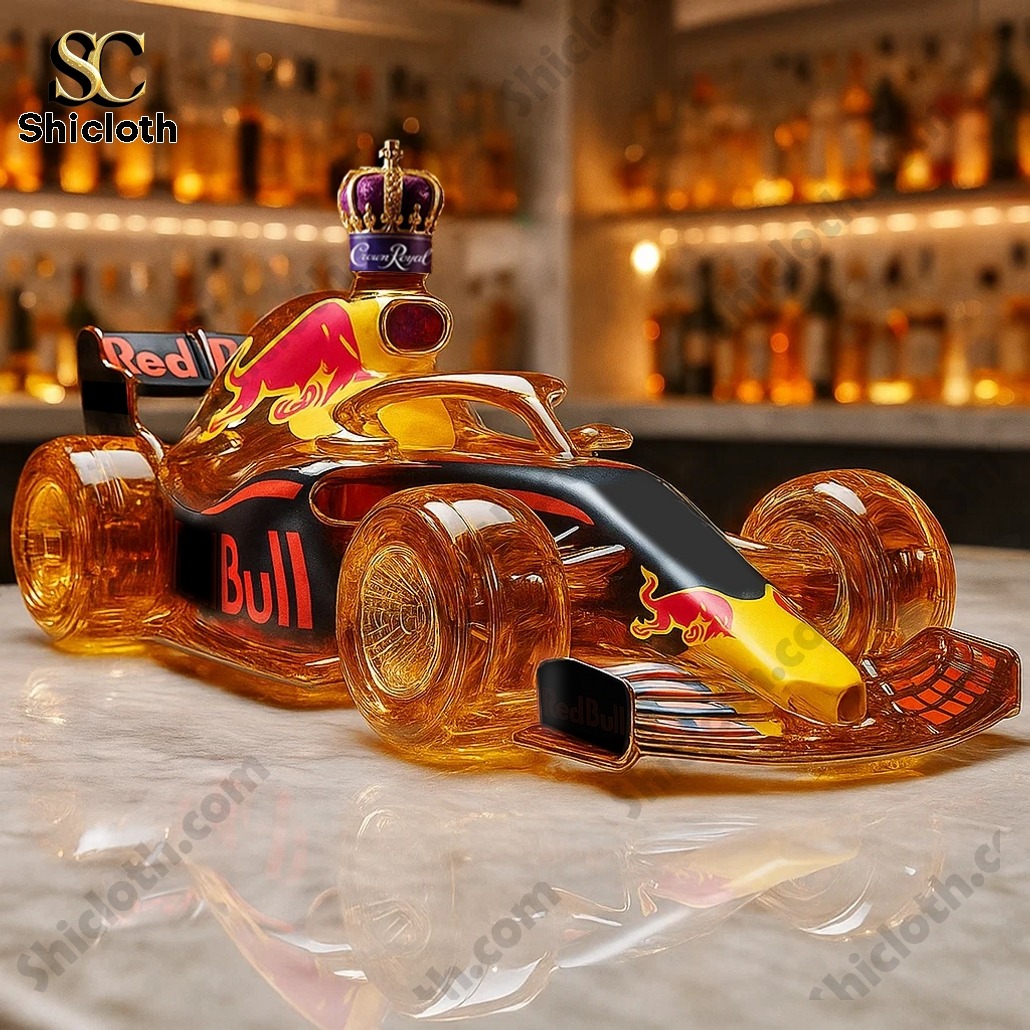 Red Bull race car shaped whiskey bottle with Crown Royal cap on a bar counter.