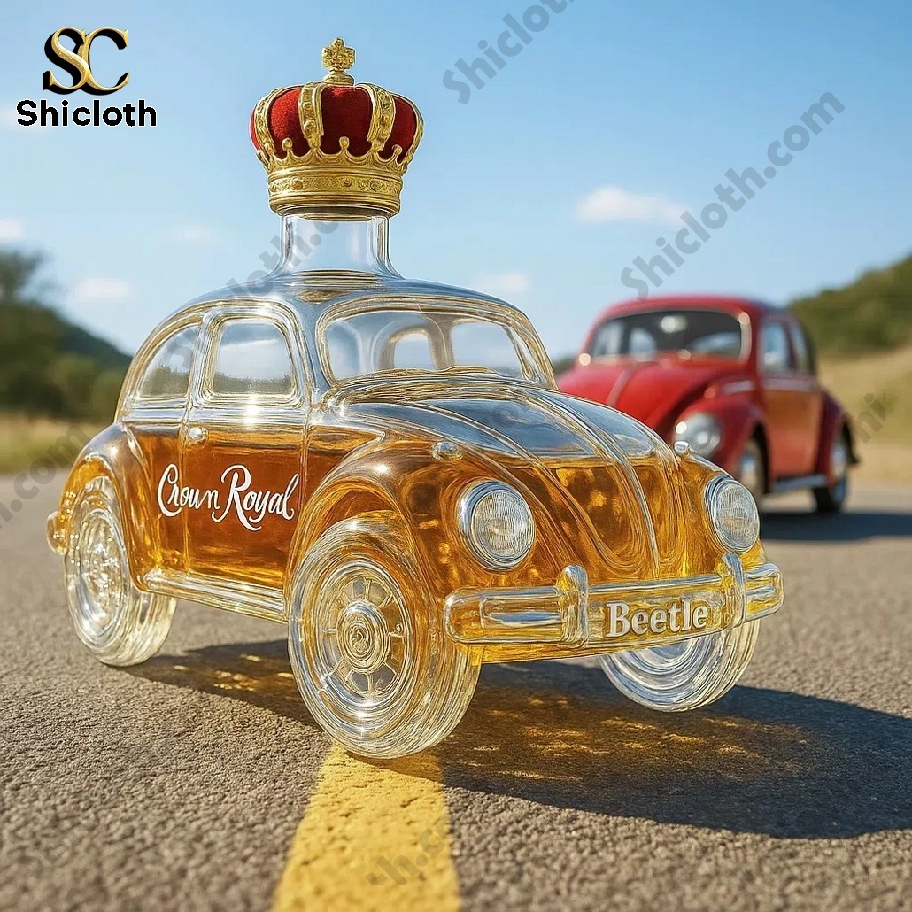 Crown Royal Beetle shaped glass whiskey bottle on a road with a red Beetle car behind