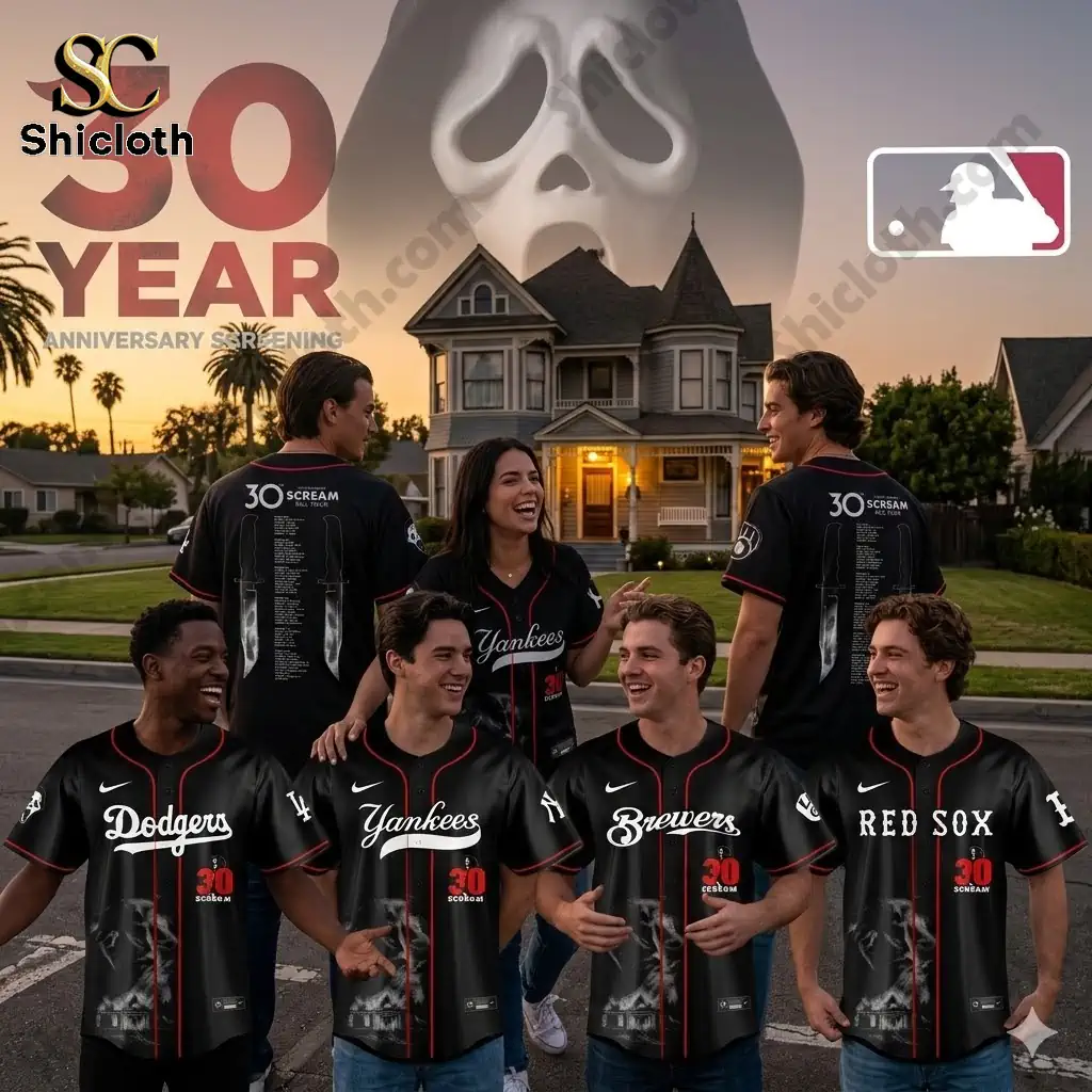 Group wearing MLB Scream anniversary jerseys in front of horror house backdrop!