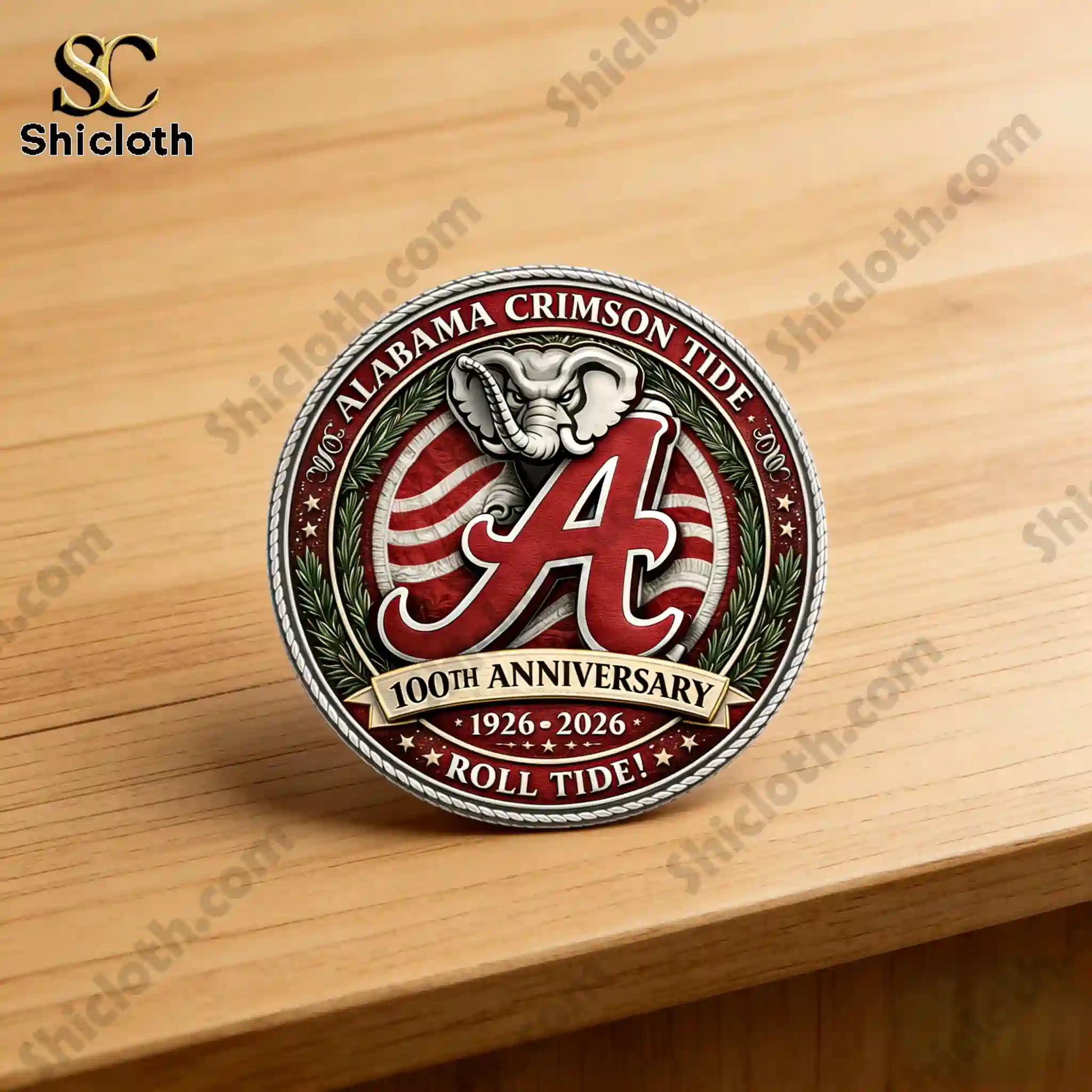 Front view of Alabama Crimson Tide 100th Anniversary commemorative coin on wooden table
