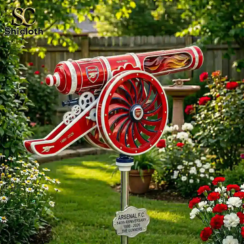 Arsenal cannon wind spinner in garden with flowers and greenery!