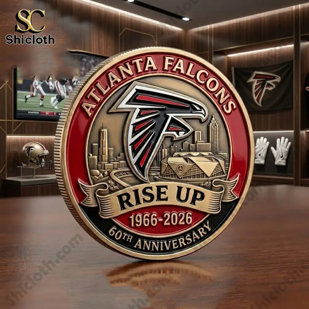 Atlanta Falcons commemorative coin displayed on wooden table in fan room!