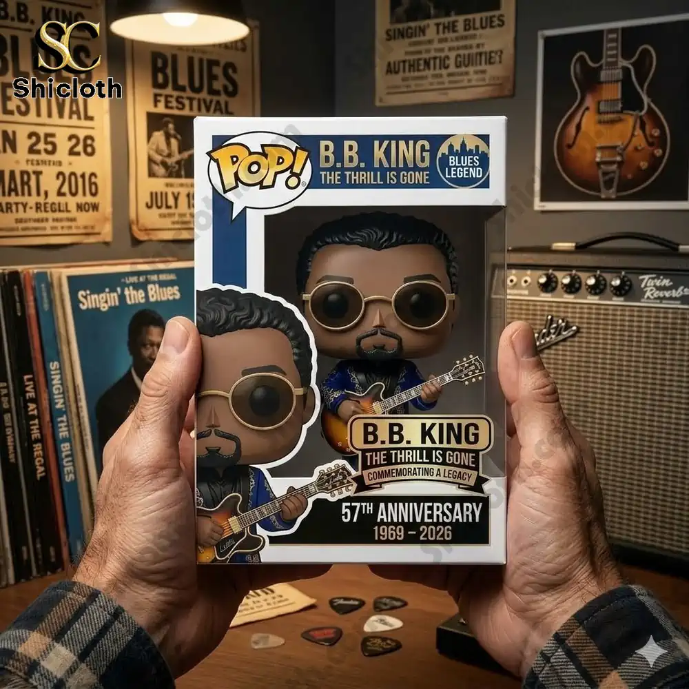 bb king style figure holding guitar in display box