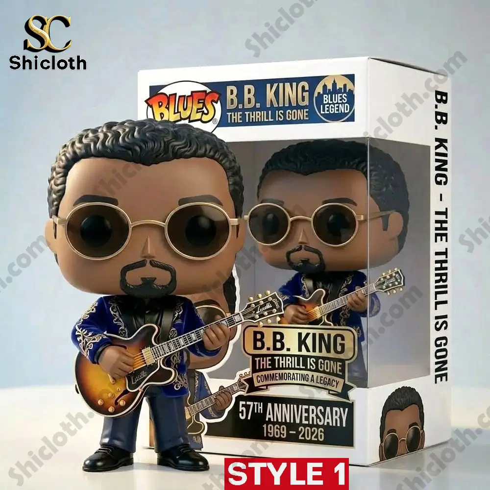 bb king style figure standing with guitar outside box