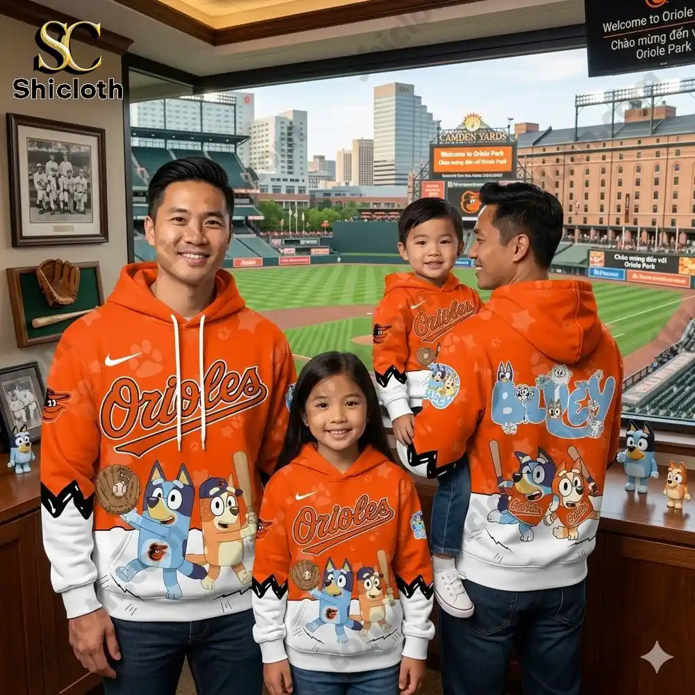 Family wearing Baltimore Orioles Bluey baseball hoodie at stadium shop display!