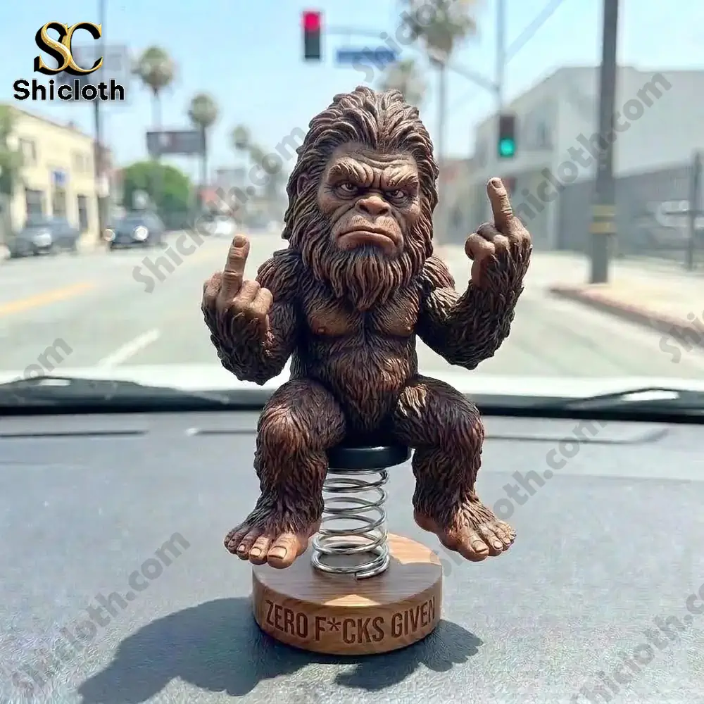Bigfoot dashboard bobblehead statue showing middle fingers on car dashboard in city street!