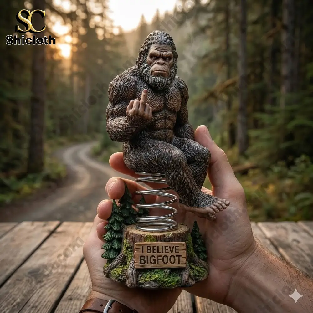 Bigfoot car dashboard bobblehead sitting on spring base with I believe Bigfoot sign!