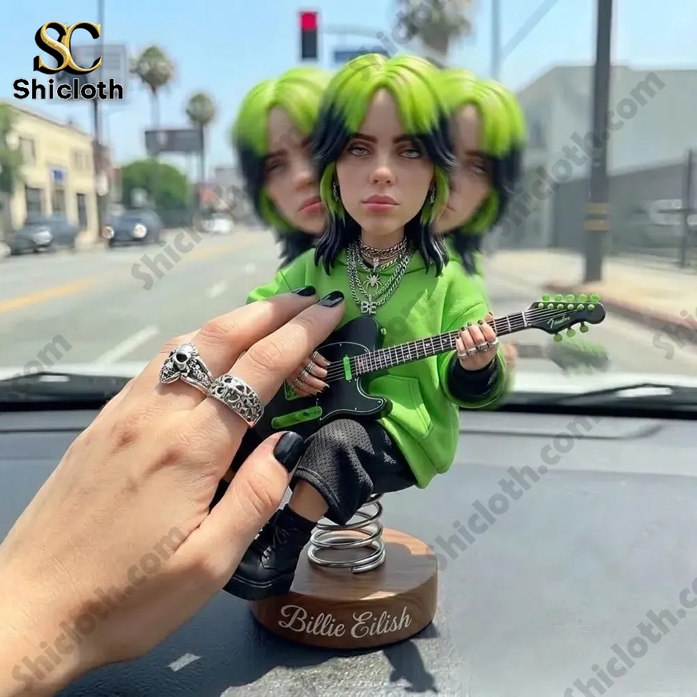 Green hair guitar bobblehead on car dashboard with hand touching figure Shicloth!