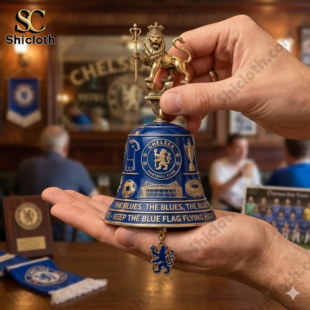 Hand holding Chelsea Football Club Pride Of London The Blues Wall Bell in a fan pub setting!