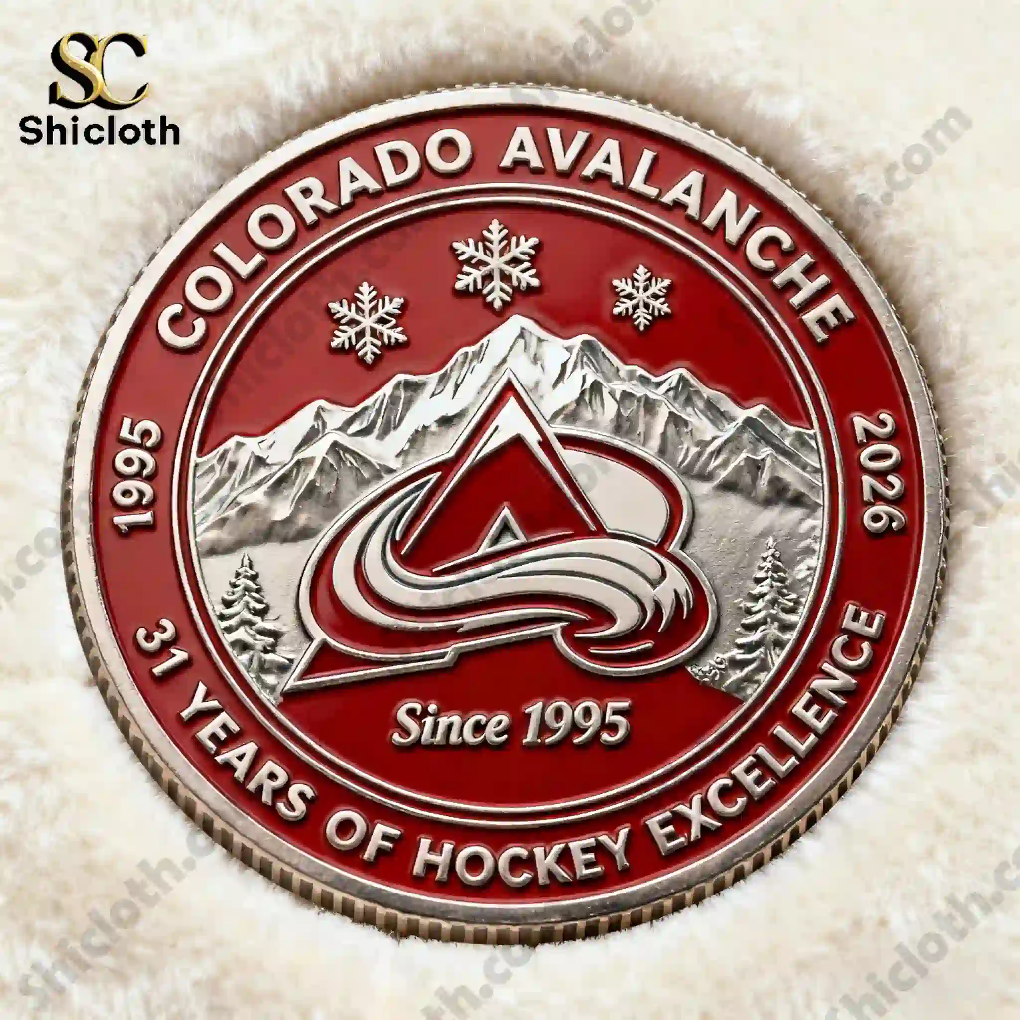 Front side of Colorado Avalanche thirty one years commemorative coin on white fabric background