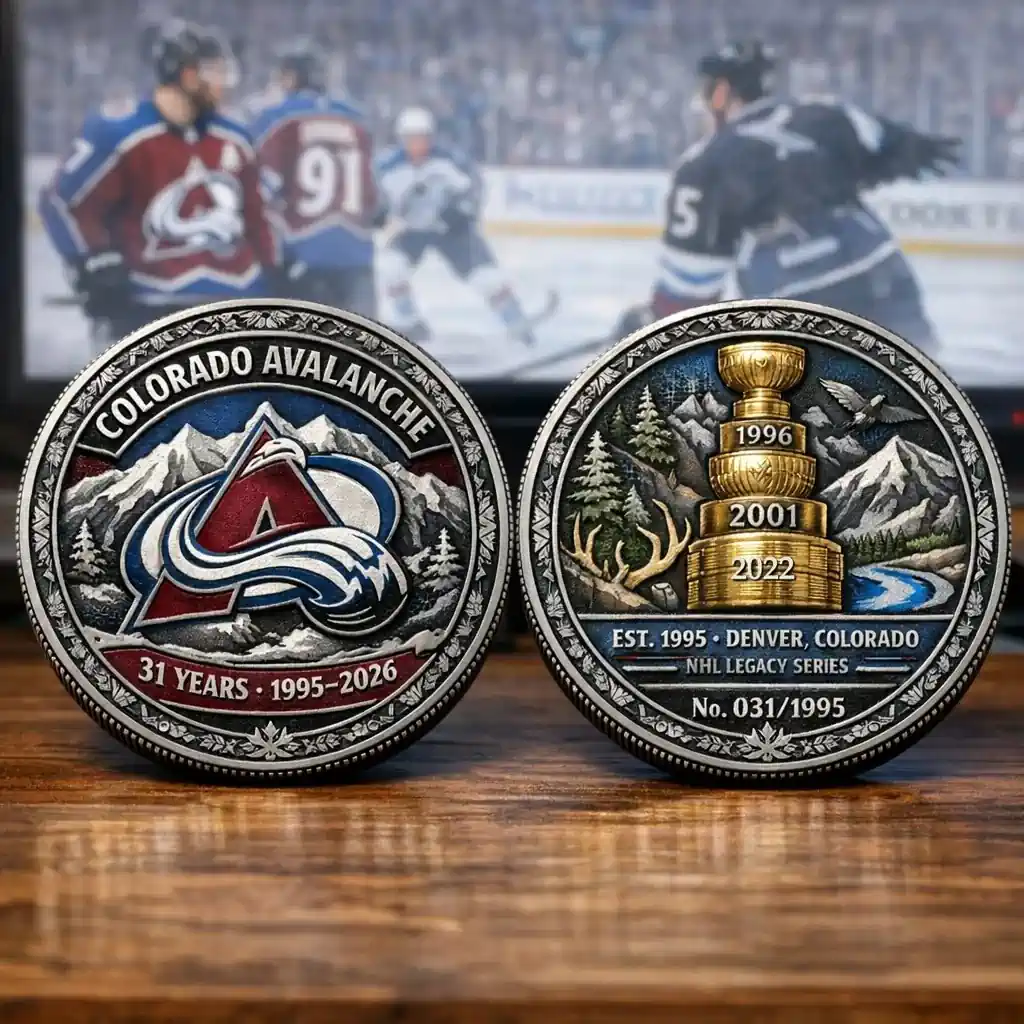 Colorado Avalanche anniversary legacy coin front and back displayed in front of hockey game background!