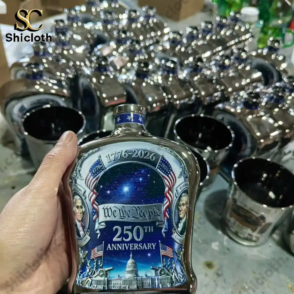 Hand holding a Shicloth anniversary flask with patriotic artwork!