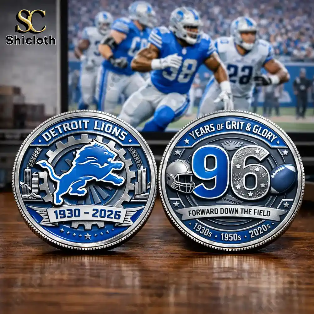 Detroit Lions anniversary commemorative coin showing both sides on table with football players in background!
