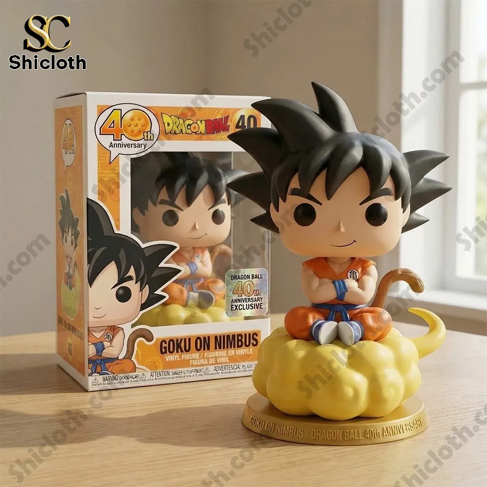 Close up of Goku On Nimbus 40th Anniversary vinyl figure with product box by Shicloth on a wooden table!