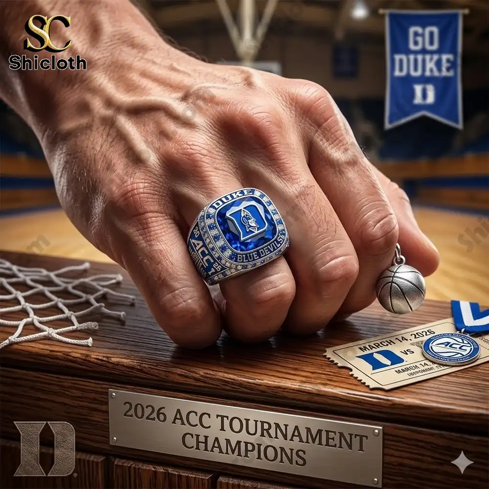 Hand wearing Duke Blue Devils championship ring on basketball court