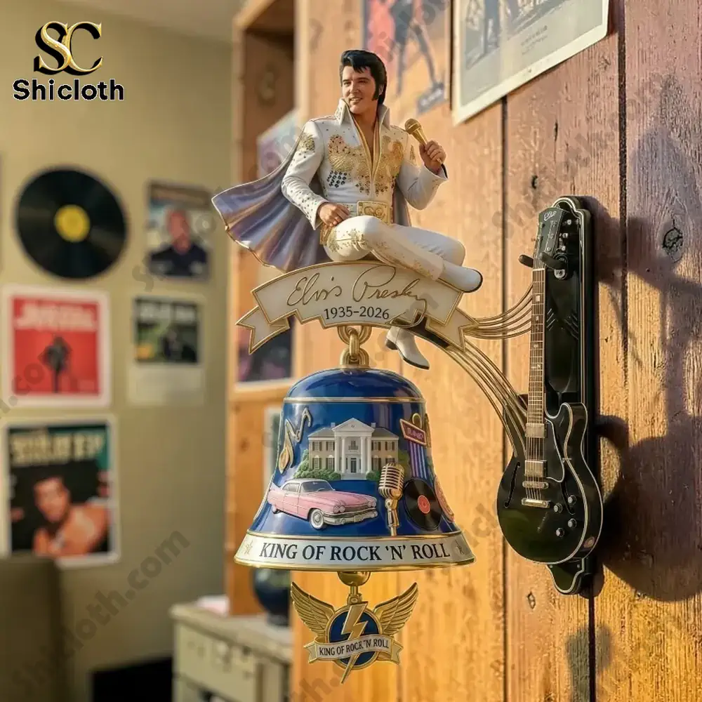 Elvis Presley commemorative wall bell mounted on wooden wall beside guitar decor!