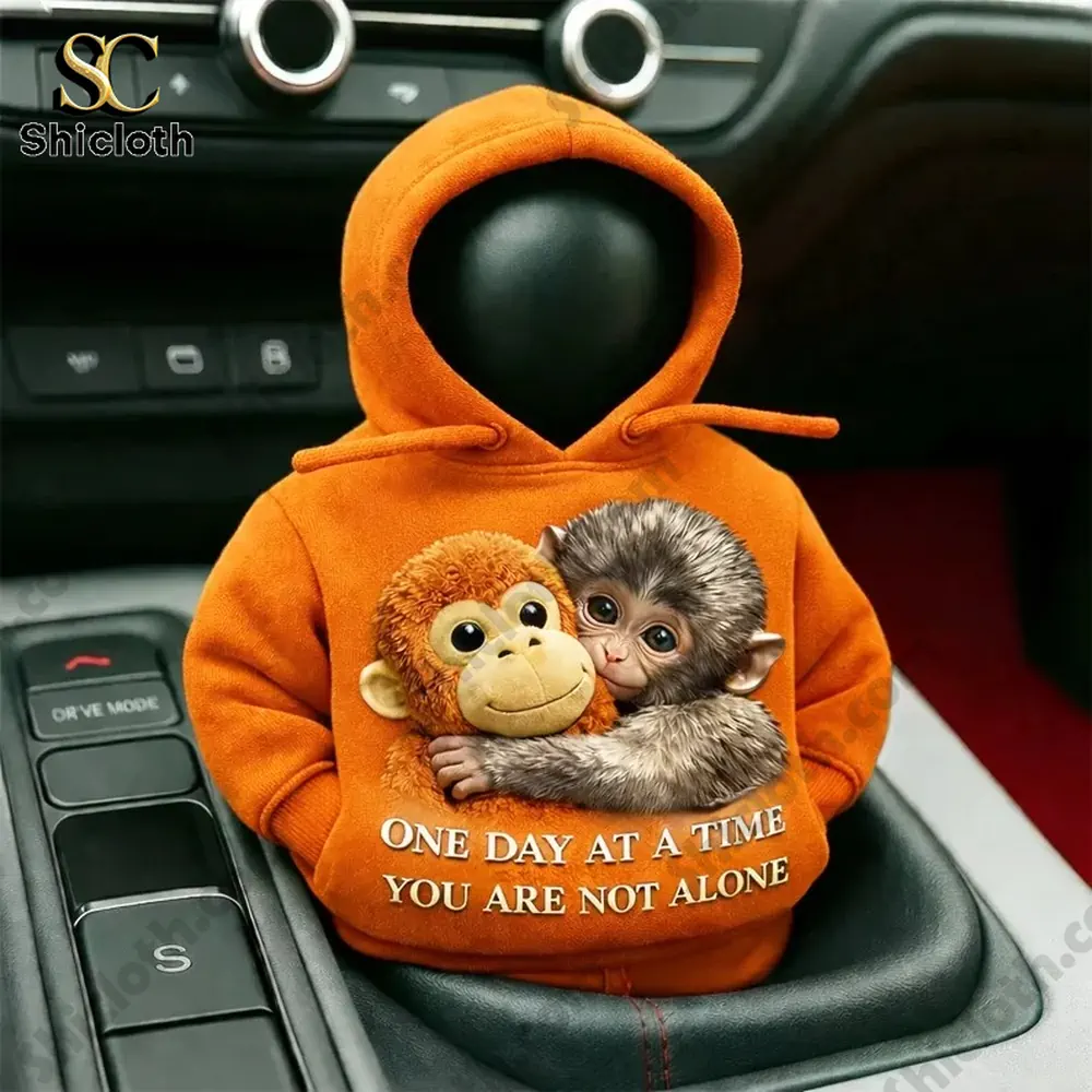 Close up orange hoodie monkey gear shift cover with cute plush design!